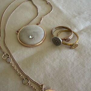 Rose gold tone pendant necklace and tri color stackable rings